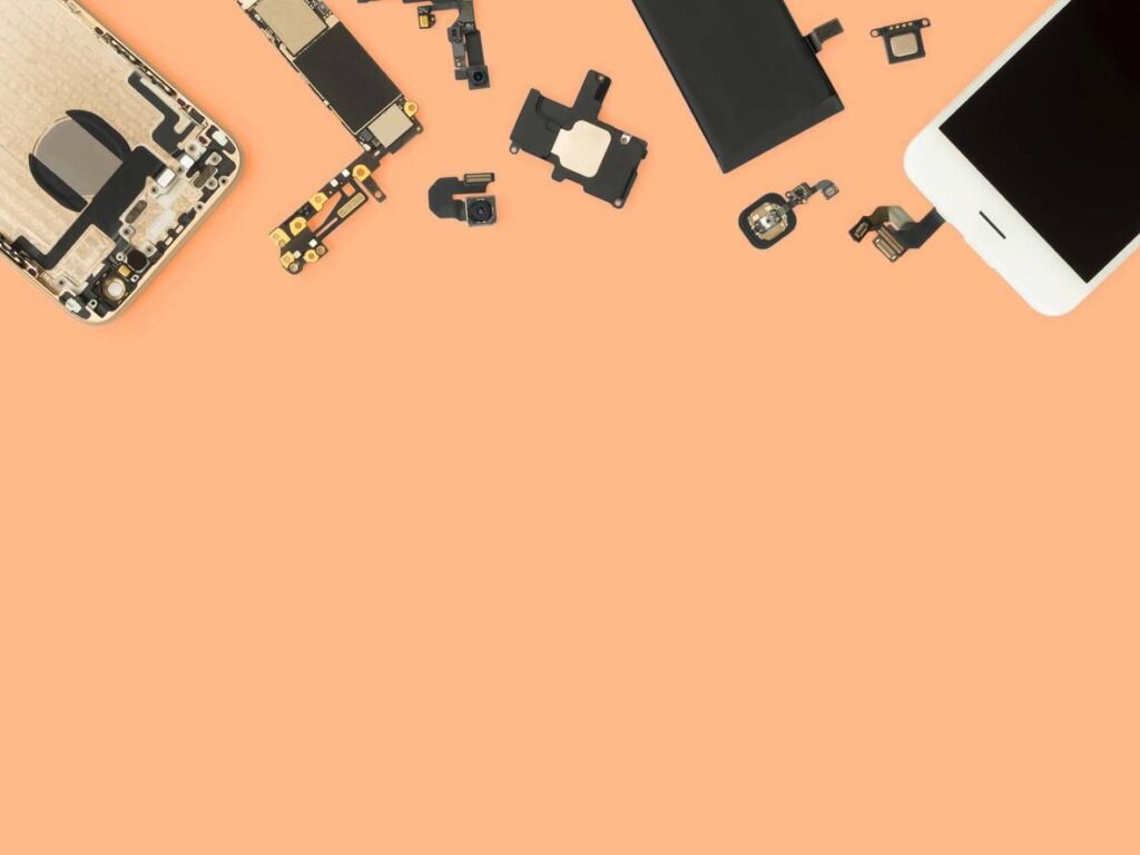 Flat Lay (Top view) of smart phone components isolate on orange background with copy space (Flat Lay (Flat Lay (Top view) of smart phone components isolate on orange background with copy space